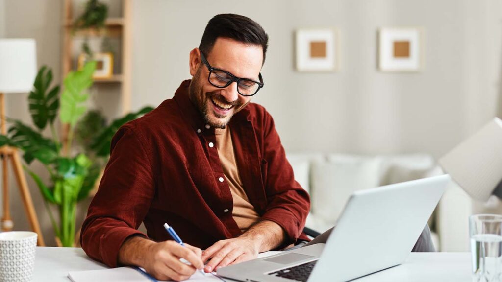 Man on Laptop Smiling